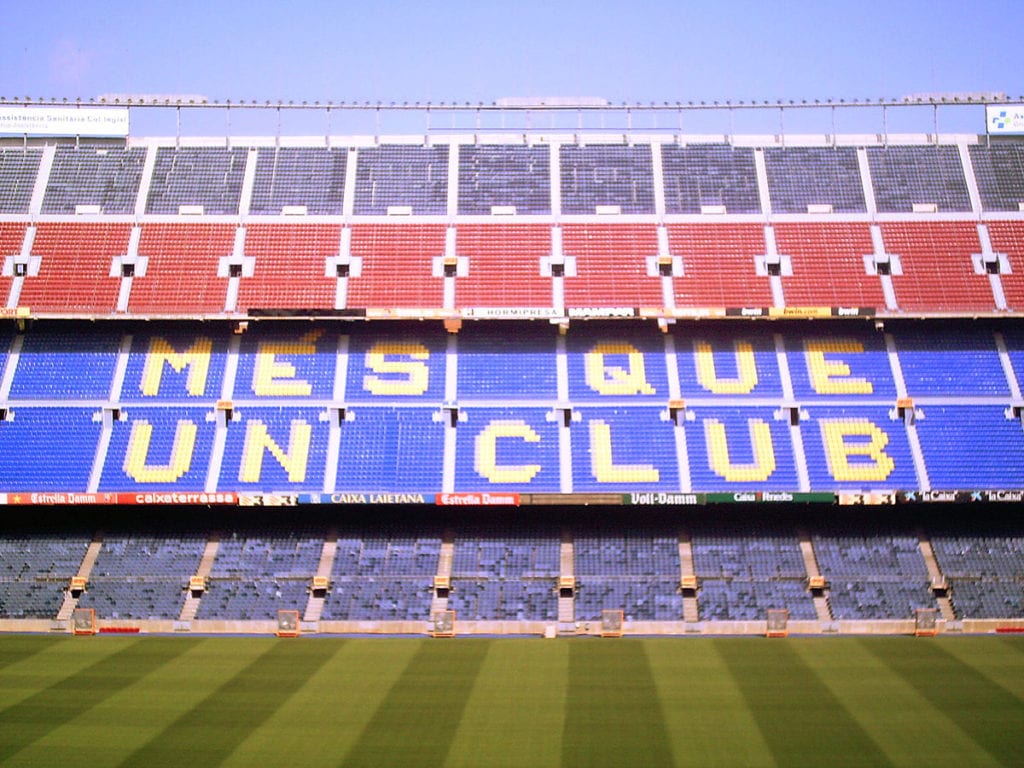 This is a photo of the stands at Camp Nou, the FC Barcelona stadium. The seats read “Més que un Club”, which means “More than a Club” in Catalan.