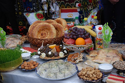traditional Tajik foods displayed on a white tablecloth